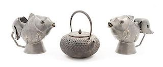 * A Pair of Chinese Pewter Fish Form Ewers Height of largest 3 1/4 x diameter 6 inches.