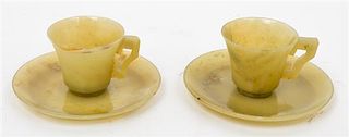 A Pair of Chinese Yellow Jade Cups and Saucers Diameter of saucer 4 3/4 inches.