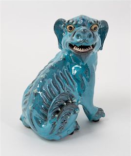 * A Chinese Glazed Stoneware Figure of a Fu Lion Height 6 3/4 inches.