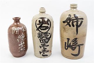 * Three Glazed Pottery Bottles Height of tallest 15 inches.