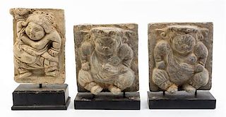 * A Group of Three Southeast Asian Figural Carvings Height of first 7 x width 5 1/4 inches.