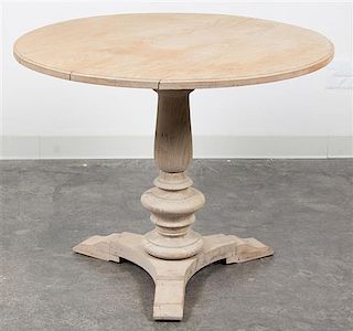 * A Neoclassical Bleached Wood Center Table Height 28 3/4 x diameter 35 inches.