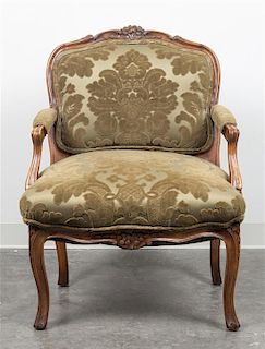* A Louis XV Style Walnut Fauteuil Height 34 x width 22 x depth 20 1/2 inches.