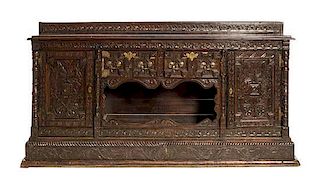 A Renaissance Revival Carved Oak Server Height 79 1/2 x width 82 1/4 x depth 21 inches.