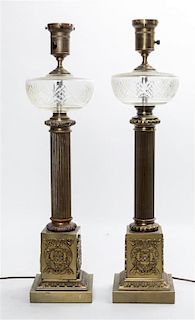 * A Pair of Brass and Cut Glass Oil Lamp Bases Height overall 26 inches.