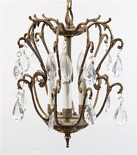 * A Continental Gilt Metal Four-Light Chandelier Height 13 1/2 inches.