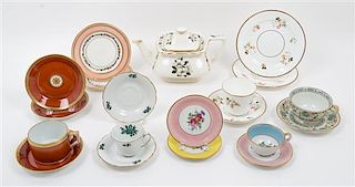 A Collection of Porcelain Cup and Saucer Sets Width of teapot over handle 10 inches.