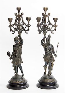 A Pair of Patinated Metal Figural Four-Light Candelabra Height 22 inches.