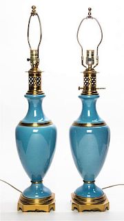 * A Pair of Continental Gilt Metal Mounted Porcelain Table Lamps Height 30 3/8 inches.