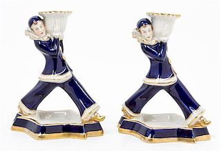 A Pair of Royal Dux Figural Candlesticks Height 6 3/4 inches.