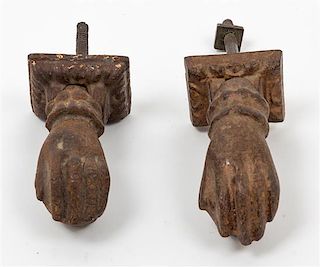 A Near Pair of Cast Metal Door Knockers Length of larger 4 inches.