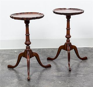 * A Pair of Chippendale Style Mahogany Candle Stands Height 19 x diameter 11 inches.