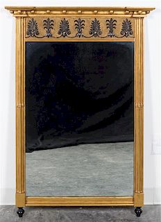 * A Regency Style Gilt and Ebonized Mirror Height 46 1/4 x width 32 inches.