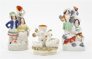 * Three Staffordshire Figural Spill Vases Height 7 3/8 inches.