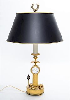 * An Empire Gilt Bronze Candlestick Clock Height overall 20 inches.
