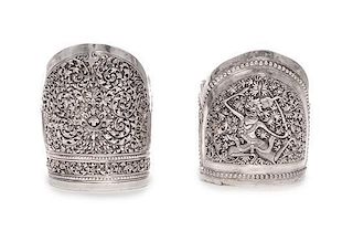 * Two Southeast Asian Silver Bangles, , one with scrolling foliate decoration, the other with a dancing figure.