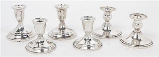 Three Pairs of American Silver Candlesticks Height of tallest pair 3 3/4 inches.