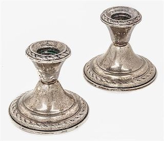 A Pair of American Silver Candlesticks, Amston Silver Co., Meriden, CT, weighted, with scrolling borders