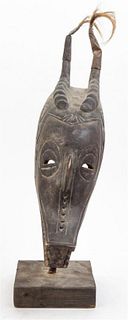* A Zambian Wood Mask Height overall 20 1/2 inches.