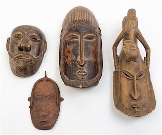 * A Collection of Eleven Masks Height of first 20 inches.
