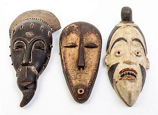 * A Group of Three Masks Height of first 19 inches.