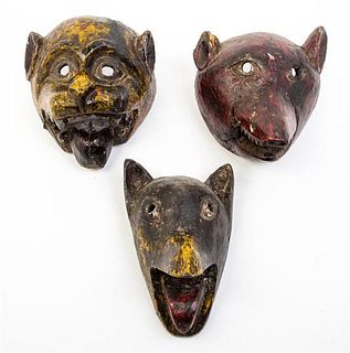 * Three Tibetan or Nepalese Wood Masks Height of tallest 10 1/2 inches.