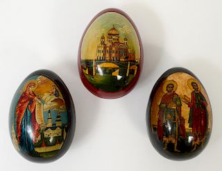 SET OF THREE RUSSIAN LACQUERED EGG FORM BOXES