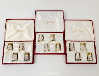 SET OF TWELVE CARTIER STERLING SILVER INDIVIDUAL SHAKERS