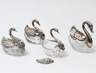 GROUP OF FOUR GLASS SWAN OPEN SALTS