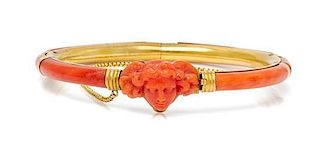 A Victorian Yellow Gold and Coral Bangle Bracelet, 13.40 dwts.