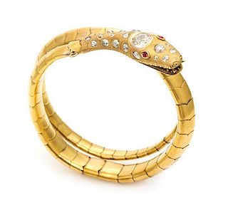 A Victorian Yellow Gold, Diamond and Ruby Serpent Bracelet, 27.10 dwts.