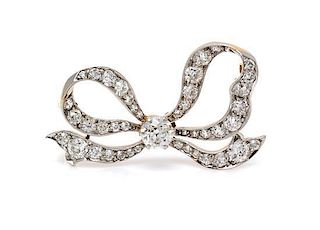 An Edwardian Platinum Topped Gold and Diamond Bow Brooch, Tiffany & Co., 5.70 dwts.