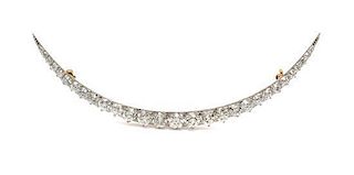 A Platinum Topped Gold and Diamond Crescent Brooch, Circa 1910, 7.60 dwts.