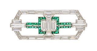 * An Art Deco Platinum, Diamond and Emerald Brooch, 9.90 dwts.