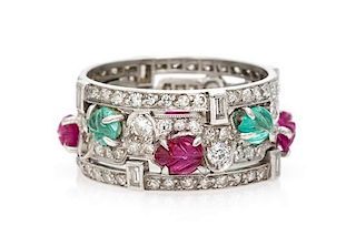 An Art Deco Platinum, Diamond, Ruby and Emerald Ring, 4.50 dwts.