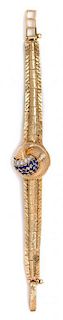 A Yellow Gold, Diamond and Sapphire Surprise Wristwatch, Lucien Piccard, 18.30 dwts.