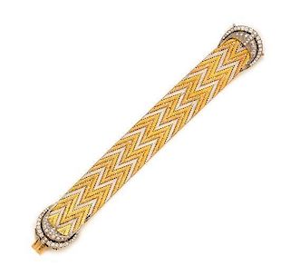 * An 18 Karat Tricolor Gold and Diamond Bracelet, Circa 1950, 38.60 dwts.