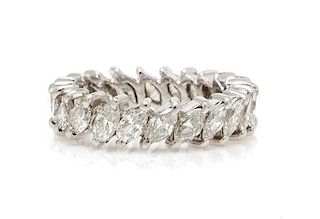 * A Platinum and Diamond Eternity Band, 3.40 dwts.