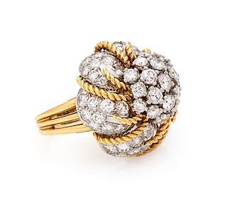 * An 18 Karat Bicolor Gold and Diamond Bombe Ring, Circa 1960, 12.40 dwts.