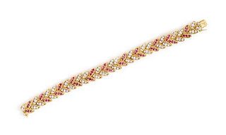 * An 18 Karat Yellow Gold, Diamond and Ruby Bracelet, French, 33.00 dwts.