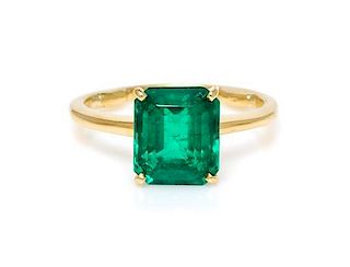 * An 18 Karat Yellow Gold and Emerald Solitaire Ring, 1.70 dwts.