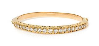 A Yellow Gold and Diamond Bangle Bracelet, 14.20 dwts.