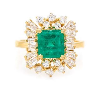 * An 18 Karat Yellow Gold, Emerald and Diamond Ring, 4.30 dwts.