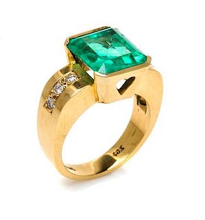 * An 18 Karat Yellow Gold, Emerald and Diamond Ring, 7.40 dwts.