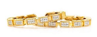 * A Pair of 18 Karat Yellow Gold and Diamond Cuff Bracelets, 54.80 dwts.
