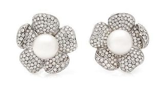 * A Pair of 18 Karat White Gold, Diamond and Cultured South Sea Pearl Earclips, 20.20 dwts.