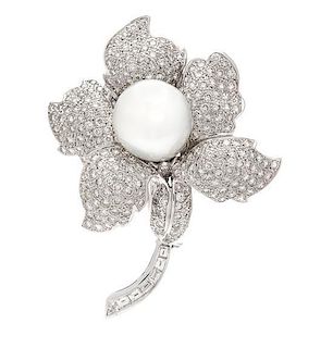 * An 18 Karat White Gold, Diamond and Cultured South Sea Pearl Flower Brooch, 19.90 dwts.