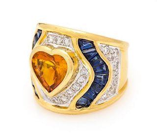 * An 18 Karat Yellow Gold, Yellow Sapphire, Sapphire and Diamond Ring, 10.70 dwts.