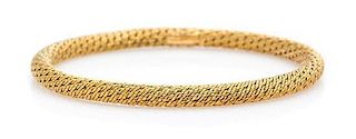 * An 18 Karat Yellow Gold Bangle Bracelet, Van Cleef & Arpels, 17.20 dwts