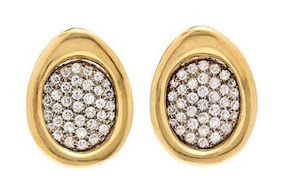 A Pair of Bicolor Gold and Diamond Earclips, 13.70 dwts.